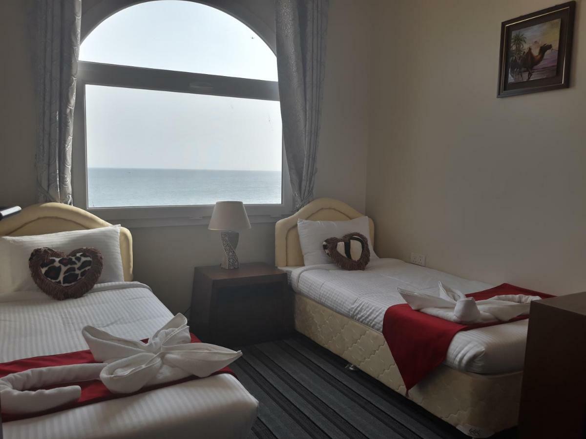 Sur Bandar Al Ayjah Hotel Apartments Esterno foto